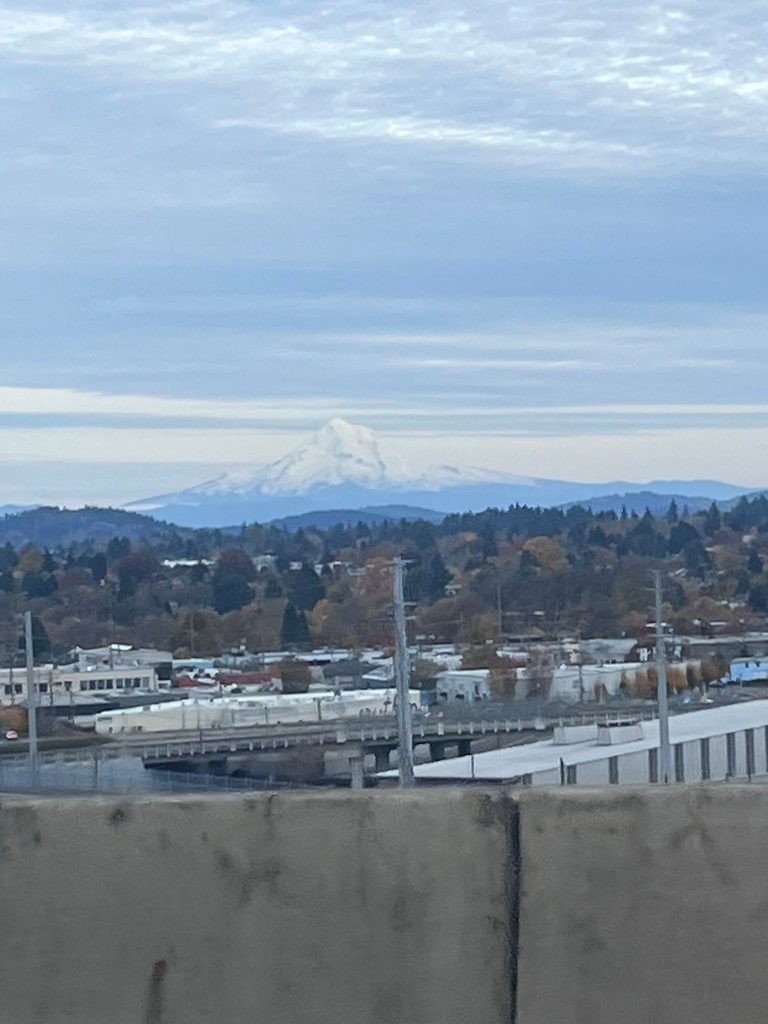 First view of snow-covered Mount Hood while driving through Portland, Oregon.