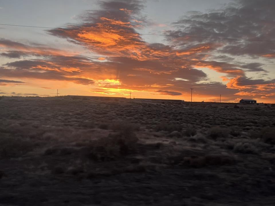 Brilliant orange sunrise and clouds viewed from Amtrak’s Empire Builder.